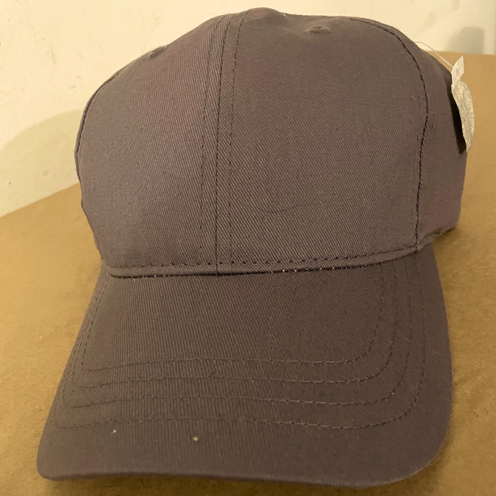 Brown Baseball style cap. One size, Adjustable snap back.
